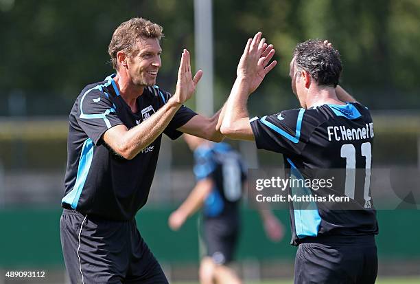 Dirk Schlebusch of Hennef jubilates with a team mate after scoring a goal during the DFB over 40 and over 50 cup at Stadion am Wurfplatz on September...