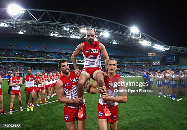 Rhyce Shaw of the Swans is chaired from the ground after his last AFL match during the First AFL Semi Final match between the Sydney Swans and the...