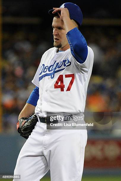 Paul Maholm of the Los Angeles Dodgers reacts after giving up a run against the San Francisco Giants at Dodger Stadium on May 9, 2014 in Los Angeles,...