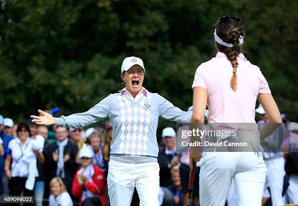 Catriona Matthew of the European Team races to embrace her partner Sandra Gal after Gal had holed a short putt to win their match by 1 hole against...