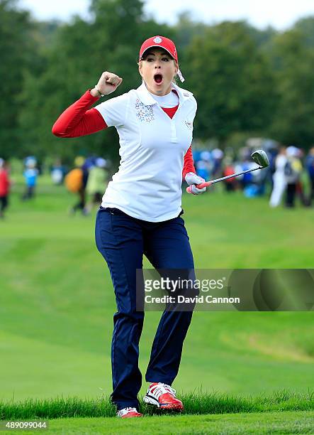 Paula Creamer of the United States reacts as her chip shot on the seventh hole goes close in her match with Morgan Pressel against Charley Hull and...