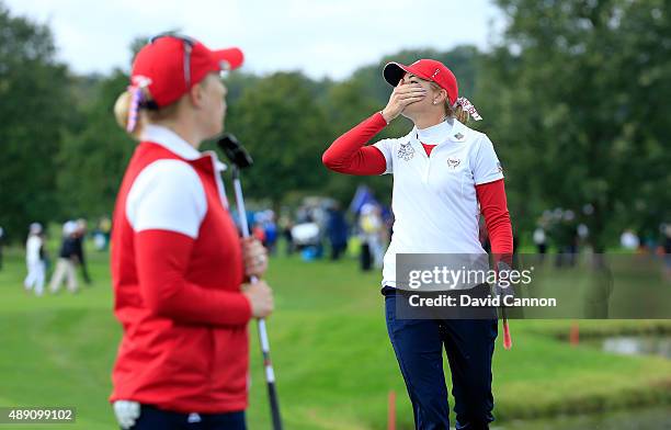 Paula Creamer of the United States reacts as her chip shot on the seventh hole just misses in her match with Morgan Pressel against Charley Hull and...