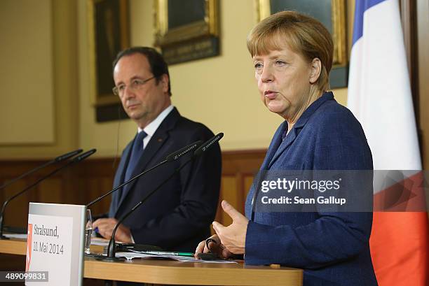 French President Francois Hollande and German Chancellor Angela Merkel speak to the media after talks that included the situtation in Ukraine on May...