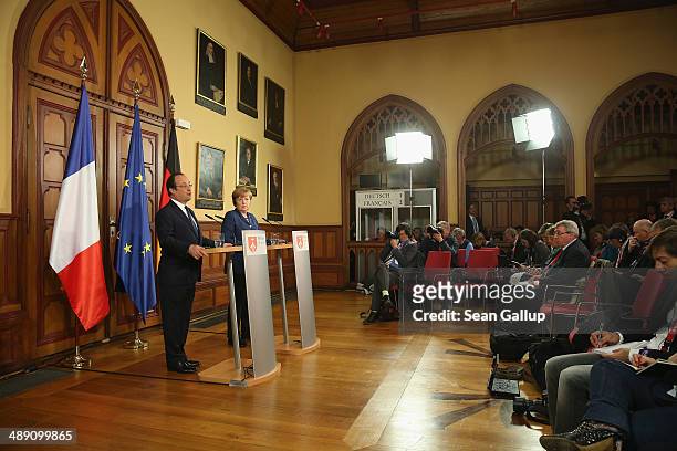 French President Francois Hollande and German Chancellor Angela Merkel speak to the media after talks that included the situtation in Ukraine on May...