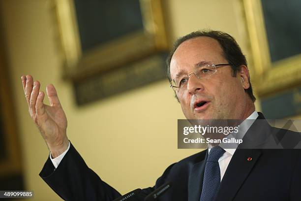 French President Francois Hollande and German Chancellor Angela Merkel speak to the media after talks that included the situtation in Ukraine on May...