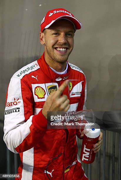 Sebastian Vettel of Germany and Ferrari celebrates in Parc Ferme after claiming pole position during qualifying for the Formula One Grand Prix of...