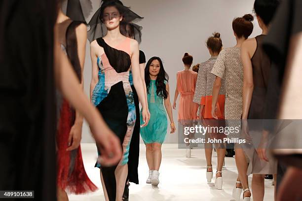 Designer Judy Wu walks amongst models during the Judy Wu show finale at Fashion Scout during London Fashion Week Spring/Summer 2016 on September 19,...