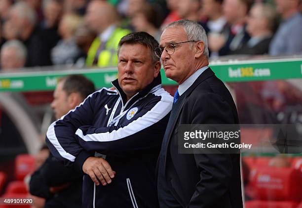 Claudio Ranieri Manager of Leicester City talks with assistant manager Craig Shakespeare during the Barclays Premier League match between Stoke City...