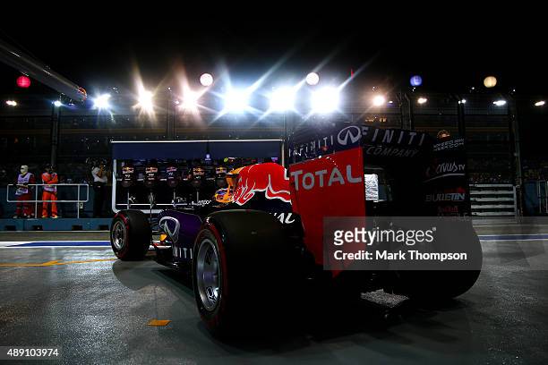 Daniil Kvyat of Russia and Infiniti Red Bull Racing exits the garage during qualifying for the Formula One Grand Prix of Singapore at Marina Bay...
