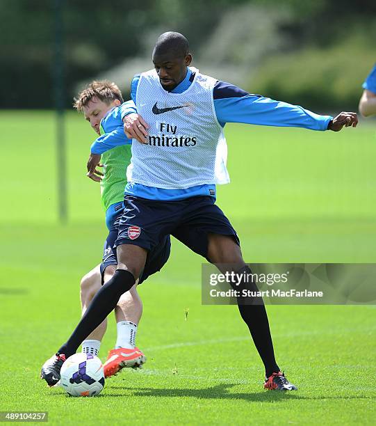 Kim Kallstrom and Abou Diaby of Arsenal during a training session at London Colney on May 10, 2014 in St Albans, England.