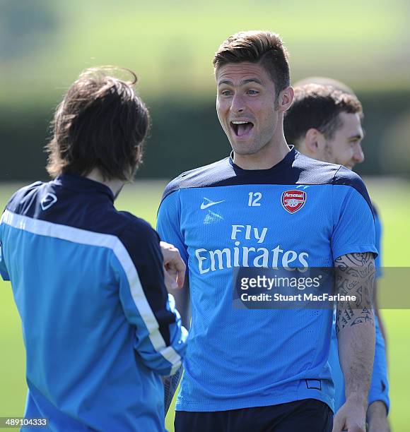 Tomas Rosicky and Olivier Giroud of Arsenal during a training session at London Colney on May 10, 2014 in St Albans, England.