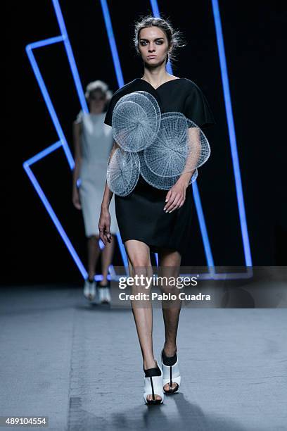 Model showcases designs by Amaya Arzuaga on the runway at the Amaya Arzuaga show during Mercedes-Benz Fashion Week Madrid Spring/Summer 2016 at Ifema...