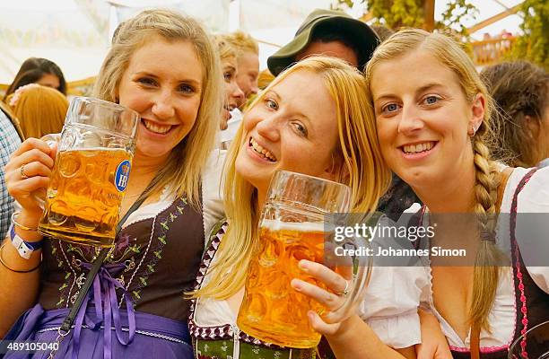 Revelers enjoy drinking beer at Hofbraeuhaus beer tent on the opening day of the 2015 Oktoberfest on September 19, 2015 in Munich, Germany. The 182nd...