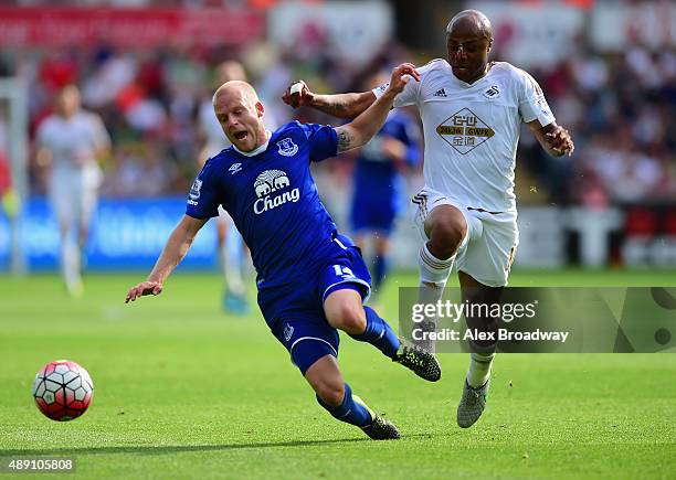 Andre Ayew of Swansea City and Ngolo Kante of Leicester City compete for the ball during the Barclays Premier League match between Swansea City and...