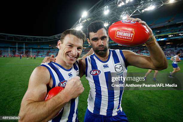 Brent Harvey and Lindsay Thomas of the Roos celebrate during the First AFL Semi Final match between the Sydney Swans and the North Melbourne...