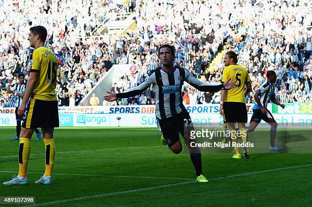 Daryl Janmaat of Newcastle United celebrates scoring his team's first goal during the Barclays Premier League match between Newcastle United and...