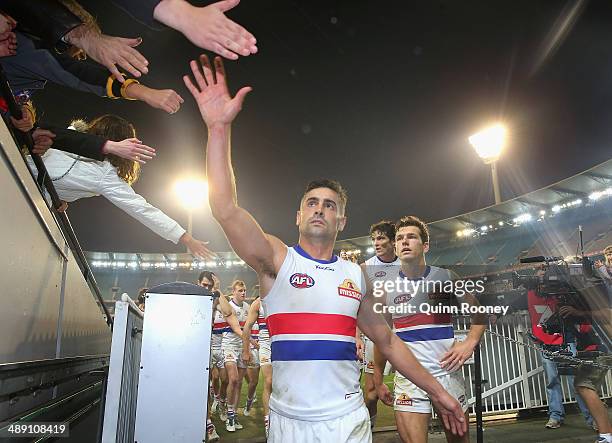 Daniel Giansiracusa of the Bulldogs high fives fans after winning the round eight AFL match between the Melbourne Demons and the Western Bulldogs at...