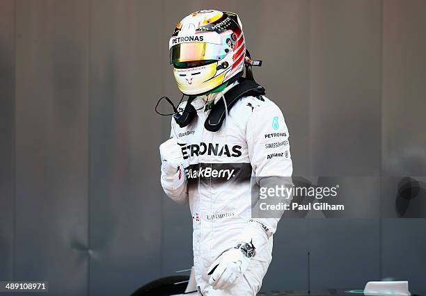 Lewis Hamilton of Great Britain and Mercedes GP celebrates after securing Pole Position during qualifying ahead of the Spanish F1 Grand Prix at...