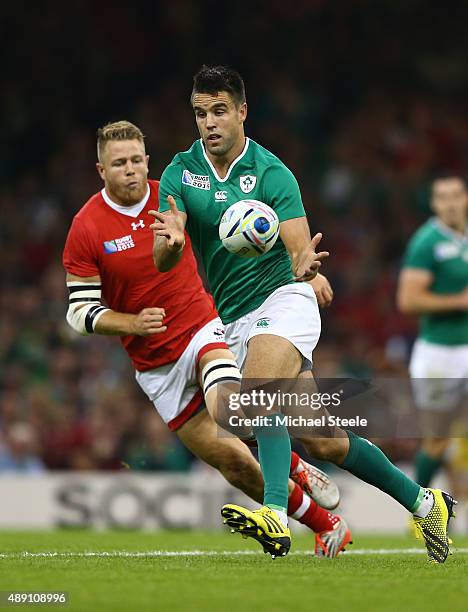 Conor Murray of Ireland ofloads during the 2015 Rugby World Cup Pool D match between Ireland and Canada at the Millennium Stadium on September 19,...