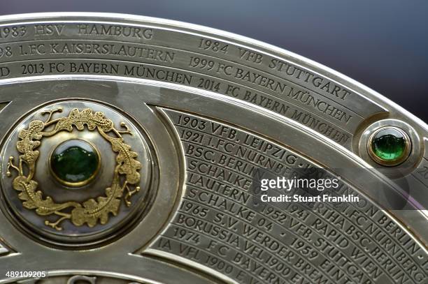 The Bundesliga trophy on display prior to the Bundesliga match between Bayern Muenchen and VfB Stuttgart at Allianz Arena on May 10, 2014 in Munich,...