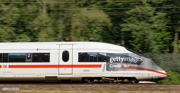 ice high speed train driving in nature - deutsche bahn stock pictures, royalty-free photos & images