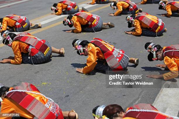 Dancers take part in a parade during the Bun Bang Fai Rocket Festival on May 10, 2014 in Yasothon, Thailand. The Bun Bang Fai Rocket festival is...