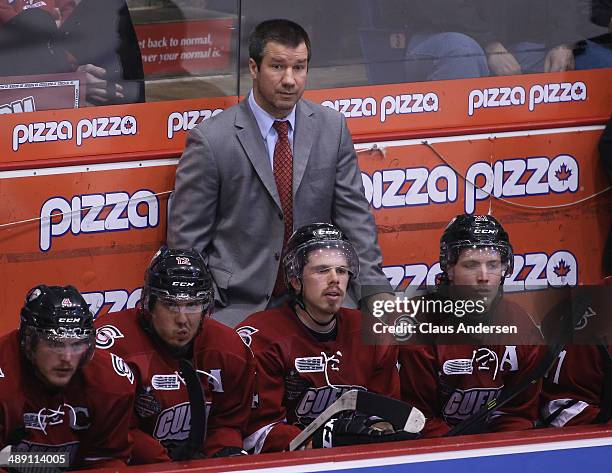 Head coach Scott Walker of the Guelph Storm watches the play against the North Bay Battalion in Game Five of the OHL Championship Final at the...
