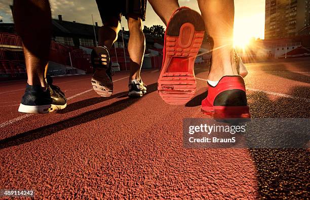 group of unrecognizable men running a sports race at sunset. - male feet soles 個照片及圖片檔