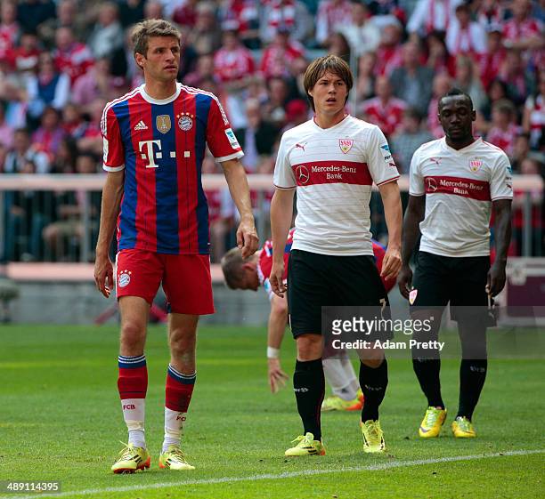 Thomas Mueller of Bayern Muenchen, Gotoku Sakai and Arthur Boka of VfB Stuttgart look on during the Bundesliga match between Bayern Muenchen and VfB...