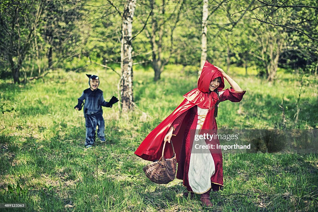 Little Red Riding Hood running from the wolf