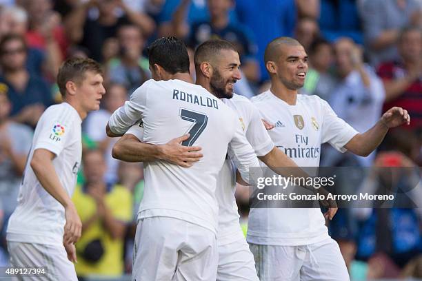 Karim Benzema of Real Madrid CF celebrates scoring their opening goal with teammates Pepe , Cristiano Ronaldo and Toni Kroos during the La Liga match...