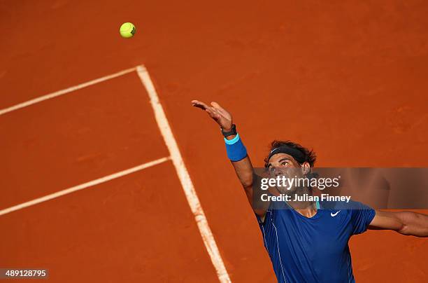 Rafael Nadal of Spain serves to Roberto Bautista Agut of Spain during day eight of the Mutua Madrid Open tennis tournament at the Caja Magica on May...