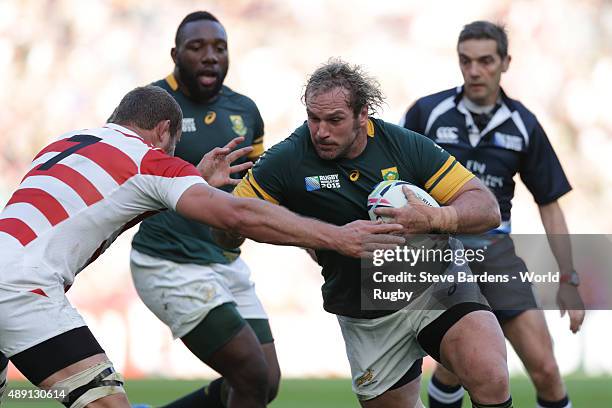 Jannie Du Plessis of South Africa takes on Michael Broadhurst of Japan during the 2015 Rugby World Cup Pool B match between South Africa and Japan at...