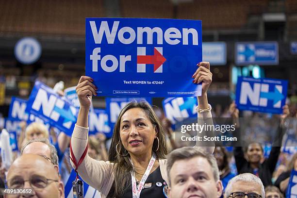 Supporter of democratic presidential candidate Hillary Clinton holds up a sign while Clinton speaks on stage during the New Hampshire Democratic...