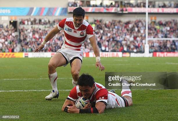 Ayumu Goromaru of Japan dives over to score his team's second try during the 2015 Rugby World Cup Pool B match between South Africa and Japan at the...