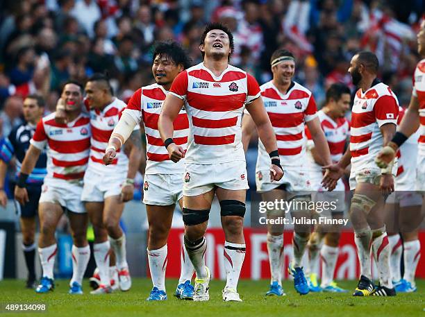 Japan players celebrate their surprise victory during the 2015 Rugby World Cup Pool B match between South Africa and Japan at the Brighton Community...