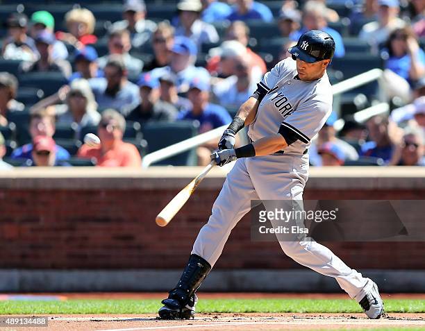 Carlos Beltran of the New York Yankees hits a three run home run in the first inning against the New York Mets during interleague play on September...