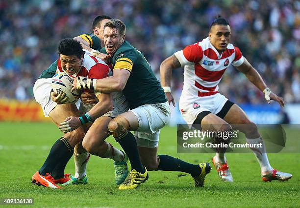 Harumichi Tatekawa of Japan is tackled during the 2015 Rugby World Cup Pool B match between South Africa and Japan at the Brighton Community Stadium...