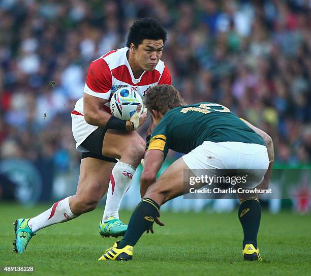 Harumichi Tatekawa of Japan takes on Pat Lambie of South Africa during the 2015 Rugby World Cup Pool B match between South Africa and Japan at the...