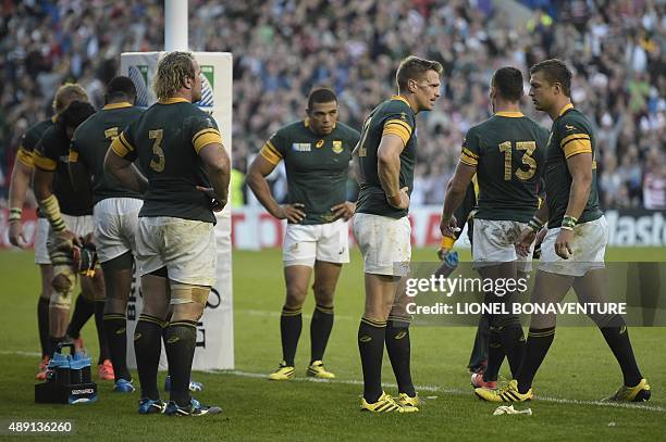 South Africa's captain and centre Jean de Villiers reacts after losing the Pool B match of the 2015 Rugby World Cup between South Africa and Japan at...