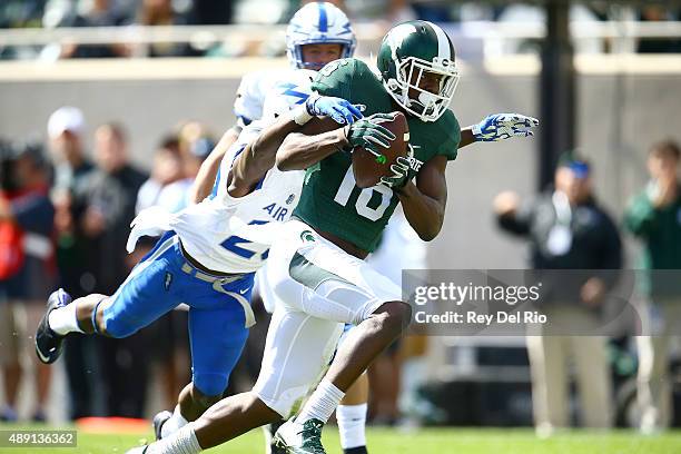Aaron Burbridge of the Michigan State Spartans runs with the ball after a catch runs for a touchdown against the Air Force Falcons at Spartan Stadium...