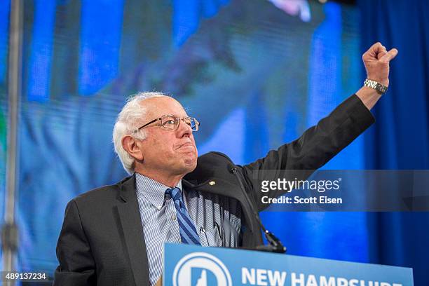 Democratic Presidential candidate Senator Bernie Sanders makes a fist while talking on stage during the New Hampshire Democratic Party State...