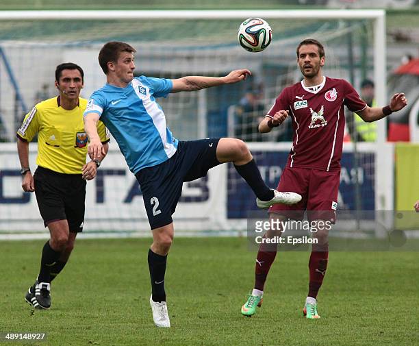 Stanislaw Drahun of FC Krylia Sovetov Samara is challenged by Marko Devic of FC Rubin Kazan during the Russian Football League Championship match...