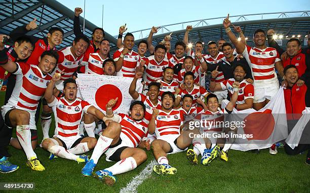 Japan players celebrate after the win over South Africa during the Rugby World Cup 2015 Pool B match between South Africa and Japan at Brighton...