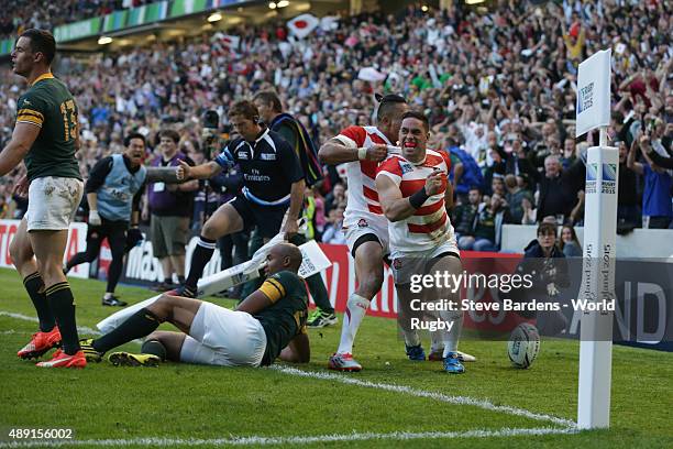 Karne Hesketh of Japan celebrates scoring the winning try during the 2015 Rugby World Cup Pool B match between South Africa and Japan at Brighton...