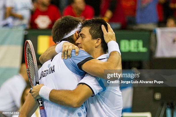 Leonardo Mayer and Carlos Berlocq of Argentina celebrate after winning the doubles match between Ruben Bemelmans/ Steve Darcis and Leonardo Mayer/...