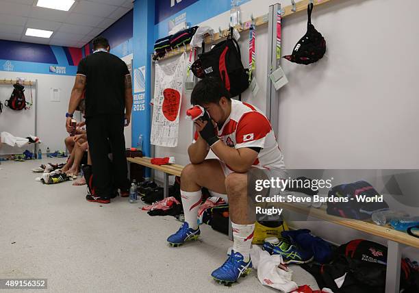 Kensuke Hatakeyama of Japan sits stunned in the dressing room following a surprise victory in the 2015 Rugby World Cup Pool B match between South...