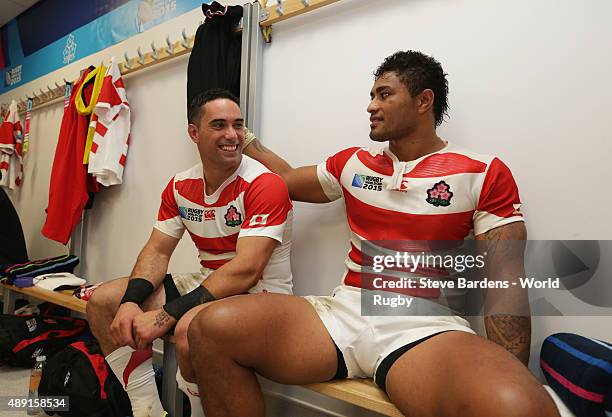 Karne Hesketh and Amanaki Mafi of Japan celebrate their surprise victory following the 2015 Rugby World Cup Pool B match between South Africa and...