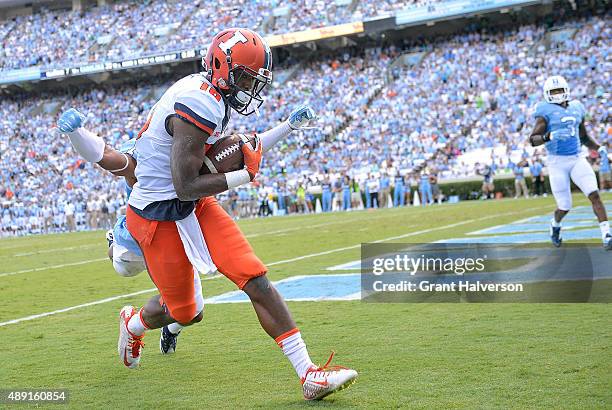 Mike Hughes of the North Carolina Tar Heels breaks up a pass to Marchie Murdock of the Illinois Fighting Illini in the end zone during their game at...