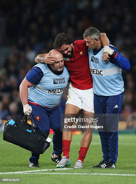 Yoann Huget of France is helped from the field following his injury during the 2015 Rugby World Cup Pool D match between France and Italy at...